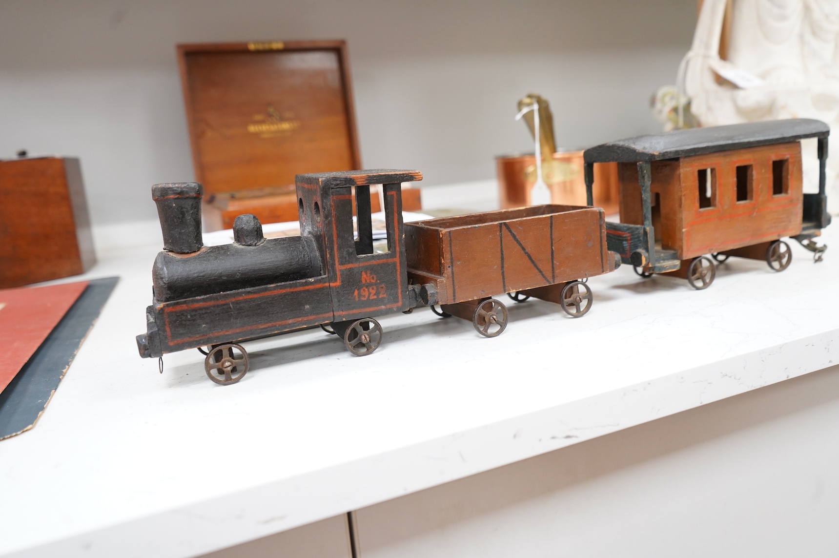 A painted wooden pull a long toy train-48cm long and two carriages, together with a painted wooden block puzzle